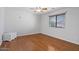 Bedroom with wood floors, a window, a ceiling fan, and a closet at 366 E Mule Train Trl, San Tan Valley, AZ 85143