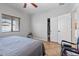 Bedroom with window, ceiling fan, and closet with sliding doors at 366 E Mule Train Trl, San Tan Valley, AZ 85143