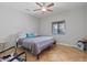 Bright bedroom with ceiling fan, window and neutral color palette at 366 E Mule Train Trl, San Tan Valley, AZ 85143