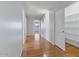 Hallway with wood floors, neutral paint, and storage at 366 E Mule Train Trl, San Tan Valley, AZ 85143