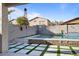 Backyard pool area with turf and water feature at 366 E Mule Train Trl, San Tan Valley, AZ 85143