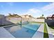 Backyard pool with a water feature, artificial turf, and a view of the neighborhood at 366 E Mule Train Trl, San Tan Valley, AZ 85143