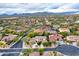 Picturesque aerial view of houses in a residential area surrounded by lush greenery and desert vegetation at 4122 E Burnside Trl, Cave Creek, AZ 85331