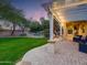 Tranquil backyard with a covered patio, lush lawn, and inviting outdoor space for relaxation at 4122 E Burnside Trl, Cave Creek, AZ 85331