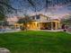 Expansive backyard featuring a covered patio, pool, and well-manicured lawn, great for outdoor activities at 4122 E Burnside Trl, Cave Creek, AZ 85331