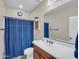 Bathroom includes blue shower curtain, cabinet and vanity at 4122 E Burnside Trl, Cave Creek, AZ 85331