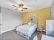 Bedroom includes a bright yellow wall with light wood furniture at 4122 E Burnside Trl, Cave Creek, AZ 85331