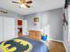 Themed bedroom with carpet flooring, ceiling fan, and basketball hoop on wall at 4122 E Burnside Trl, Cave Creek, AZ 85331