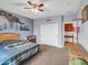 View of themed bedroom with carpet flooring, ceiling fan, and view to attached room at 4122 E Burnside Trl, Cave Creek, AZ 85331