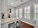 Bright dining area featuring a breakfast bar with granite countertops and white cabinets at 4122 E Burnside Trl, Cave Creek, AZ 85331