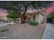 Charming home exterior featuring stone accents and lush landscaping at 4122 E Burnside Trl, Cave Creek, AZ 85331