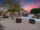 Stunning exterior of a two-story home with a well-manicured front yard at sunset at 4122 E Burnside Trl, Cave Creek, AZ 85331