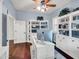 Bright home office with built-in shelving, a large desk, and ample storage space at 4122 E Burnside Trl, Cave Creek, AZ 85331