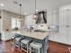 Modern kitchen with white cabinets, a large island, and stylish pendant lighting at 4122 E Burnside Trl, Cave Creek, AZ 85331