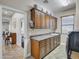 Spacious laundry room with wood cabinetry, granite counters, and stainless machines at 4122 E Burnside Trl, Cave Creek, AZ 85331