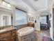 Main bathroom with oval soaking tub, tile floors, granite countertop vanities, decorative faucets and a shower room at 4122 E Burnside Trl, Cave Creek, AZ 85331