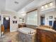 Main bathroom with oval soaking tub, tile floors, granite countertop vanities, decorative faucets and a shower room at 4122 E Burnside Trl, Cave Creek, AZ 85331