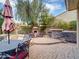 Well-equipped outdoor kitchen and dining area with a built-in grill, perfect for entertaining friends and Gathering at 4122 E Burnside Trl, Cave Creek, AZ 85331