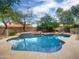 Inviting backyard pool with rock features and a spa, perfect for relaxation and outdoor fun at 4122 E Burnside Trl, Cave Creek, AZ 85331