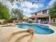 Sparkling swimming pool with rock features, offering a refreshing oasis for summer enjoyment at 4122 E Burnside Trl, Cave Creek, AZ 85331