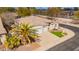 Aerial view of home showcasing lush landscaping and a three-car garage at 44 W Teakwood Pl, Chandler, AZ 85248