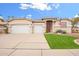 Charming home with a three-car garage, well-kept lawn, and inviting curb appeal under a sunny sky at 44 W Teakwood Pl, Chandler, AZ 85248