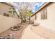 Gravel-covered side yard with mature trees and a stone-lined pathway at 44 W Teakwood Pl, Chandler, AZ 85248