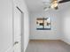 Cozy bedroom with carpet, a ceiling fan, and a window with view, plus closet at 45997 W Windmill Dr, Maricopa, AZ 85139