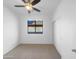 Bedroom showcasing carpet flooring, a window view, and closet space with a ceiling fan at 45997 W Windmill Dr, Maricopa, AZ 85139