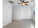 Bedroom featuring neutral carpet, a ceiling fan, and a window for natural lighting at 45997 W Windmill Dr, Maricopa, AZ 85139