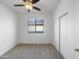 Simple bedroom with carpet flooring, closet, and natural light from the window at 45997 W Windmill Dr, Maricopa, AZ 85139