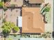 Aerial view of a home's roof, backyard, and shed with desert landscaping at 4720 E Flossmoor Cir, Mesa, AZ 85206