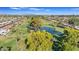 Scenic aerial perspective of lush green golf course, mature trees, pond, and residential homes at 4720 E Flossmoor Cir, Mesa, AZ 85206