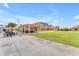 Community center in Sunland Village with outdoor seating and views of the manicured grounds at 4720 E Flossmoor Cir, Mesa, AZ 85206