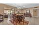 Dining room with seating for six and sliding door access to the patio at 4720 E Flossmoor Cir, Mesa, AZ 85206