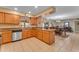 Spacious kitchen with granite counters, a kitchen island, and tiled flooring at 4720 E Flossmoor Cir, Mesa, AZ 85206