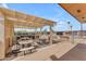 Outdoor BBQ area provides a perfect spot for entertaining Gathering and friends under a shaded patio at 4720 E Flossmoor Cir, Mesa, AZ 85206