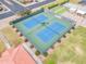 Overhead shot of two tennis courts with manicured landscaping at 4720 E Flossmoor Cir, Mesa, AZ 85206