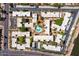 Aerial view of community shows central pool, mature landscaping, and ample parking at 4950 N Miller Rd # 231, Scottsdale, AZ 85251