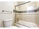 Bathroom with tiled tub/shower combo with sliding glass doors and modern fixtures at 4950 N Miller Rd # 231, Scottsdale, AZ 85251