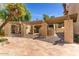 A welcoming courtyard features a pergola, terracotta tile, and comfortable seating at 4950 N Miller Rd # 231, Scottsdale, AZ 85251