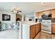 Kitchen area with white counters and stainless appliances next to open dining area at 4950 N Miller Rd # 231, Scottsdale, AZ 85251