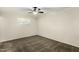 Bedroom with neutral carpet, ceiling fan, and a window at 501 E Hermosa Dr, Tempe, AZ 85282