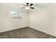 Cozy bedroom featuring neutral walls, plush carpeting, and a modern ceiling fan at 501 E Hermosa Dr, Tempe, AZ 85282