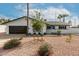 Charming single-story home featuring a well-maintained desert landscape and attached garage at 501 E Hermosa Dr, Tempe, AZ 85282