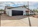 Single-story home with driveway leading to garage, desert landscaping and an enclosed private yard at 501 E Hermosa Dr, Tempe, AZ 85282