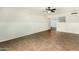 Bright living room featuring neutral tones, tile flooring, and a half wall to the next room at 501 E Hermosa Dr, Tempe, AZ 85282