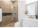 Modern bathroom featuring a tiled walk-in shower, sleek fixtures, and a contemporary vanity at 510 E Woburn Ln, Phoenix, AZ 85085