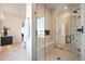 Modern bathroom featuring a spacious glass shower enclosure with a built-in bench and sleek fixtures at 510 E Woburn Ln, Phoenix, AZ 85085