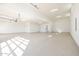 Expansive garage with clean epoxy floors, recessed lighting, and ample space at 510 E Woburn Ln, Phoenix, AZ 85085